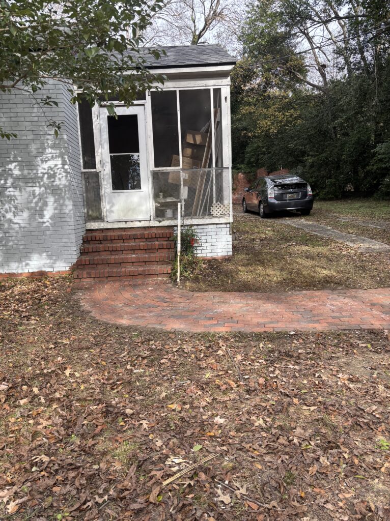 Cleared area in front of home after junk removal